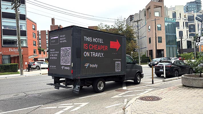 Grow More mobile LED truck displaying a travel platform launch campaign